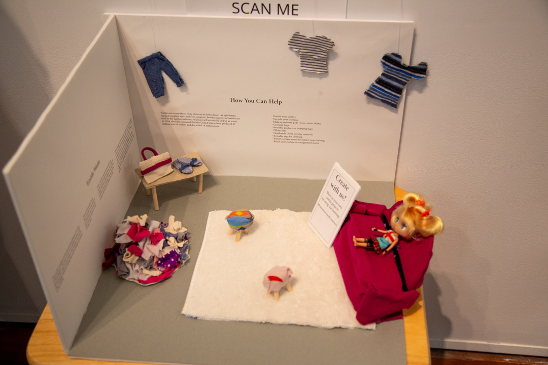 Photo of diorama style art focusing on textile waste awareness