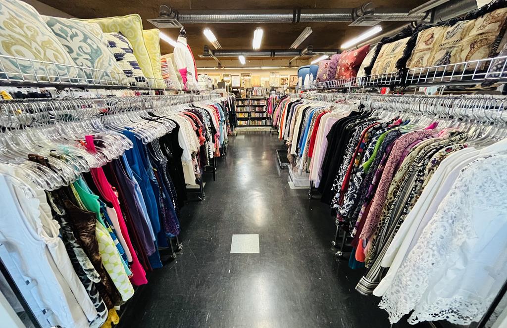 An assortment of clothes  in the thrift for life store
