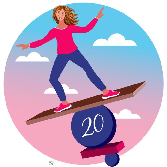 A girl balances on a ball with the number twenty on it. There is a smaller ball underneath. Sky with clouds are in the background.