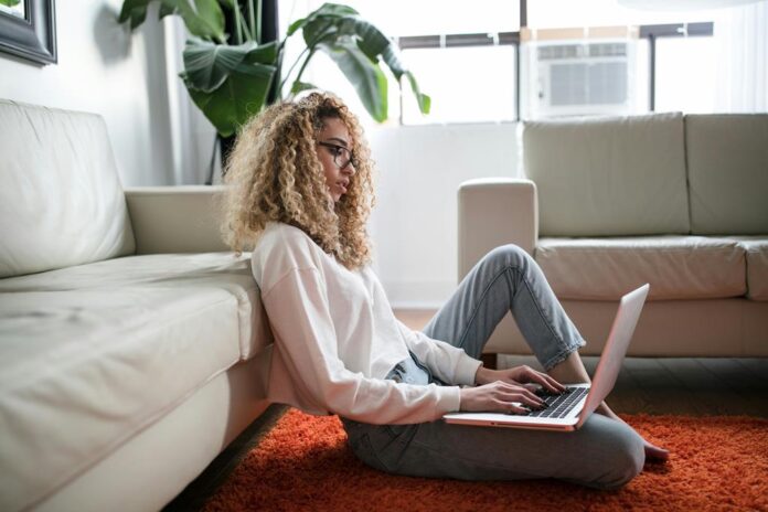 A photo of a woman using her laptop