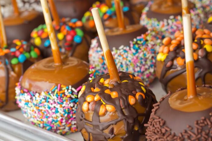 Tray of assorted variety of candy apples at state fair