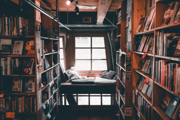 Photo of a cozy room full of books and on shelves