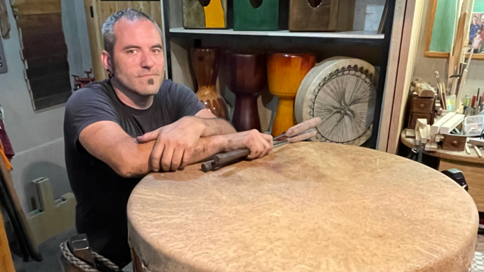 Photo of one of Greg Weber with one of his drums