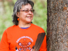 Photo of Phyllis Webstad in an orange shirt