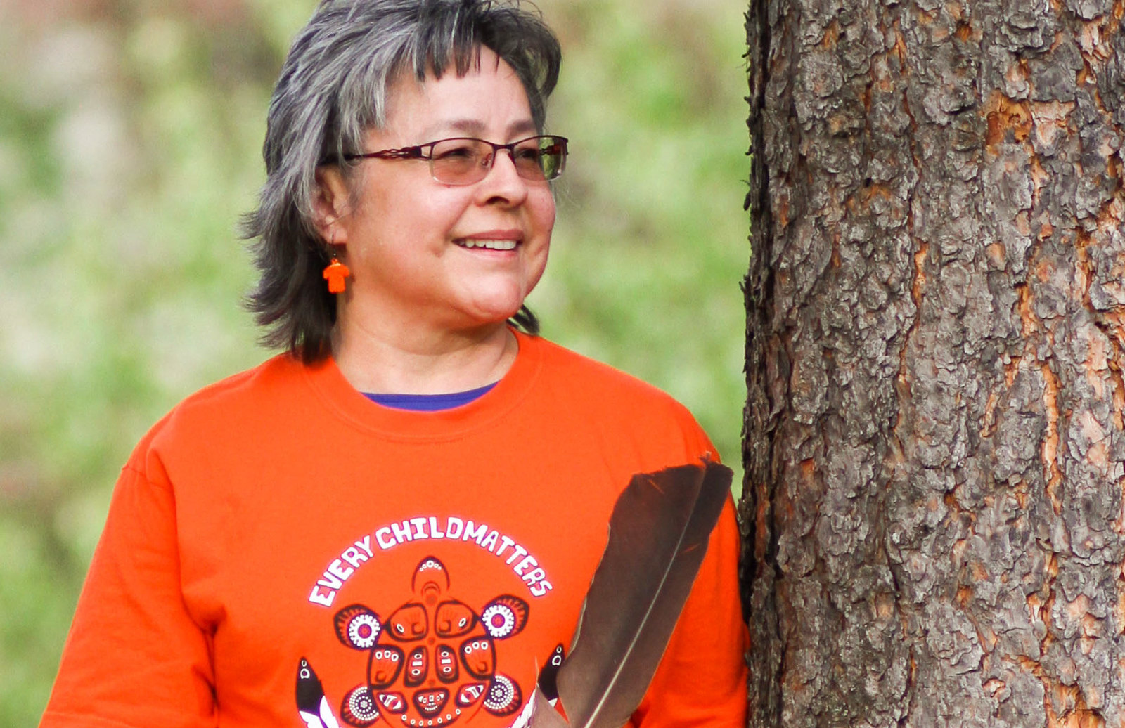 Photo of Phyllis Webstad in an orange shirt