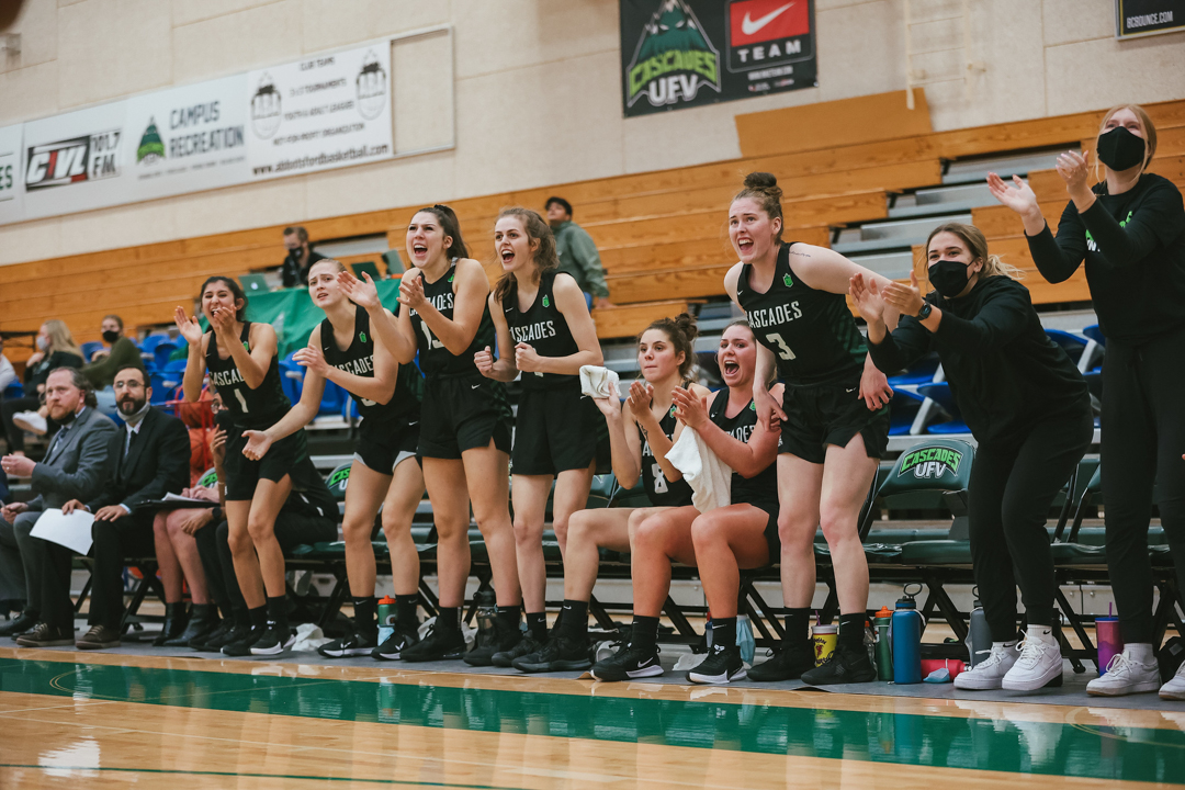 Cascades women's basketball team cheering on their teammates