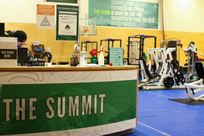 Gym equipment and front desk of The Summit