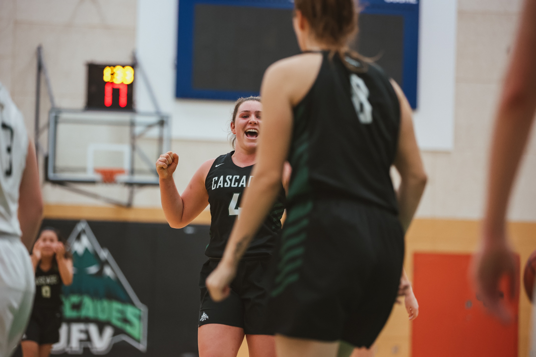 Photo of Maddy Gobeil celebrating with a team meate