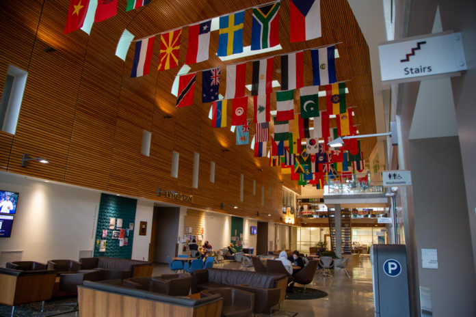 Photo of the Student Union Building, focusing on the flags hanging from the ceiling