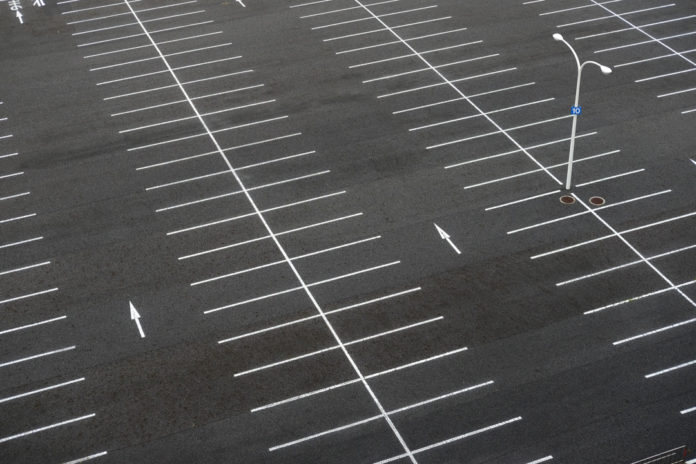 Stock photo of a large empty parking lot.