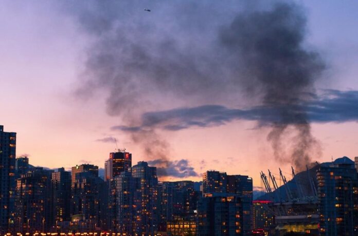 The city of vancouver emitting clouds of smoke due to the riots