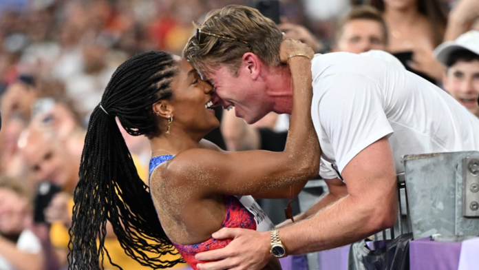 Tara Davis-Woodhall and her husband Hunter Woodhall celebrate Tara's win at the 2024 Olympics